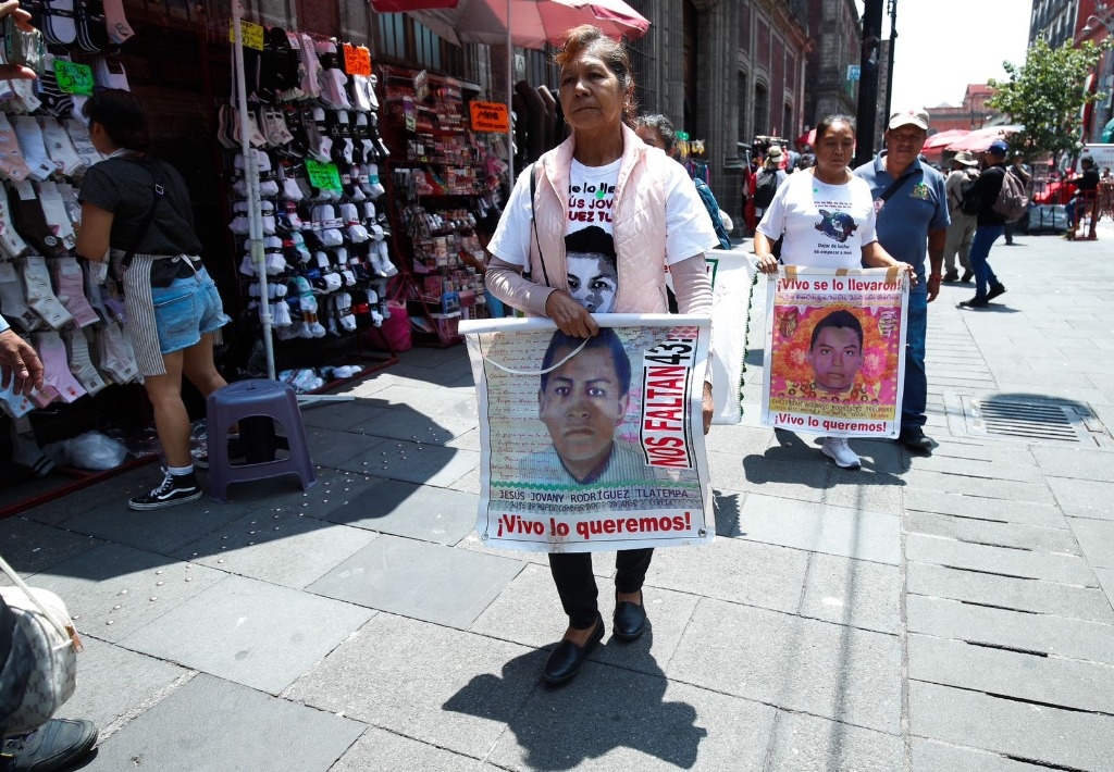 Relatives of the 43 arrive at a meeting with AMLO at the National Palace