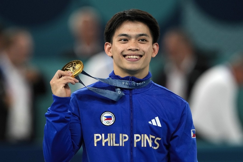 Carlos Yulo wins historic Olympic gold for Philippines in gymnastics