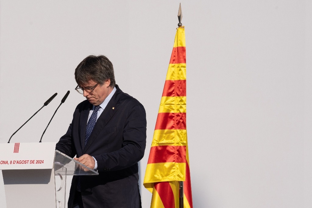 Catalan independence supporters celebrate their national day divided and weakened