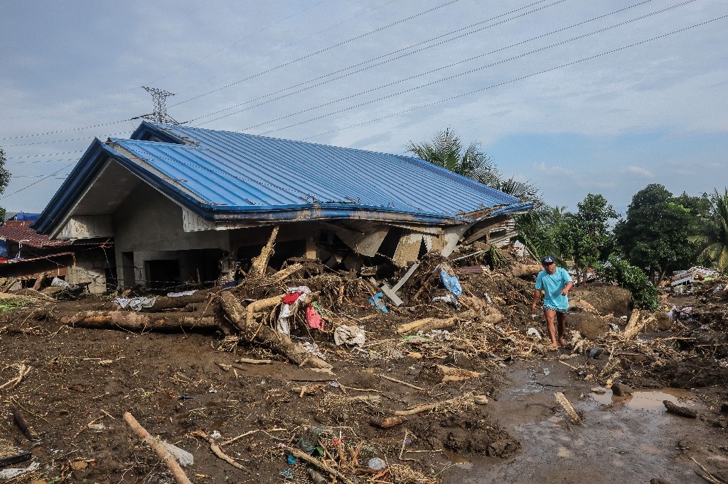 Floods and landslides in the Philippines leave at least 130 dead