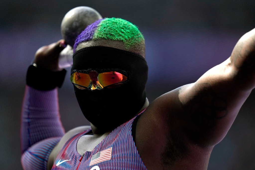 Raven Saunders from the USA competes in shot put with a black mask