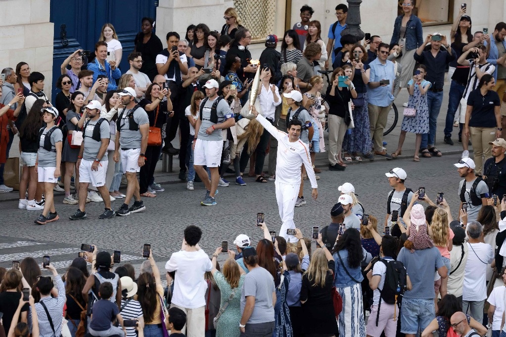 Paris receives the Olympic flame on France’s nationwide vacation